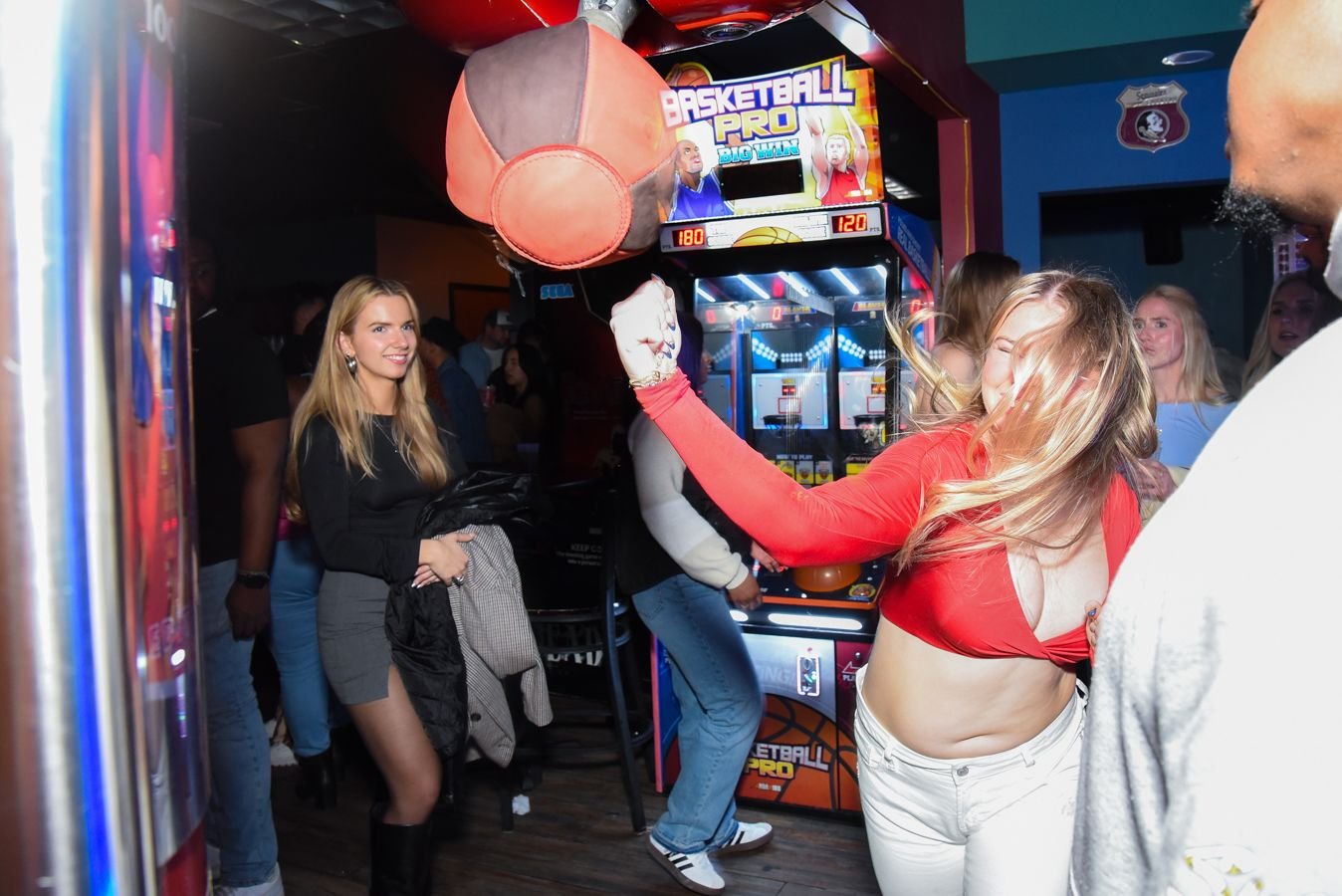 Guests playing air hockey at Play Pensacola